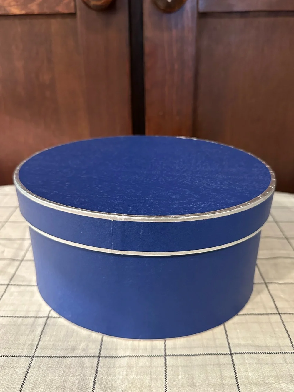 Heavy cardboard • oval lidded box • in new condition • blue w/silver trim